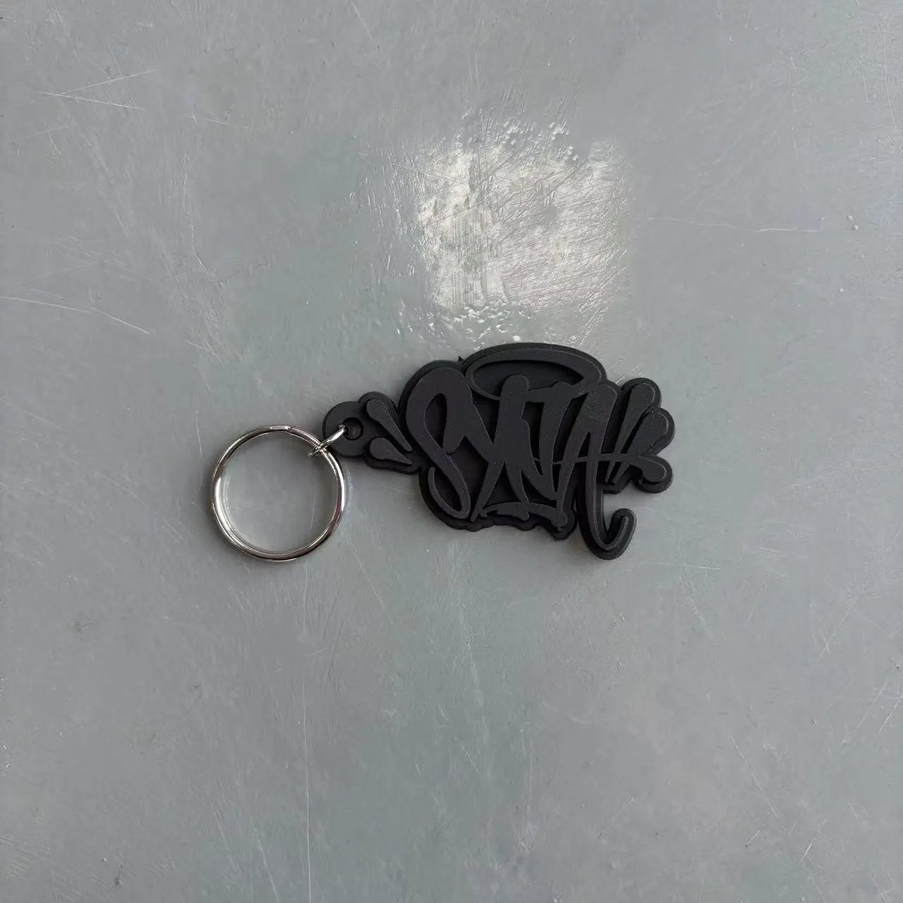 Syna W0rld KeyChain