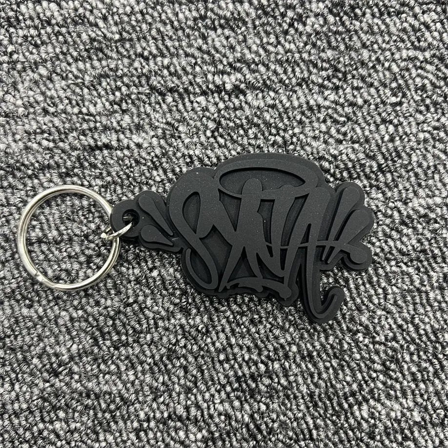 Syna W0rld KeyChain